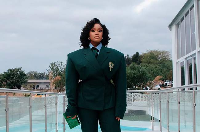 Actress Dineo Langa in a structured, dramatic suit
