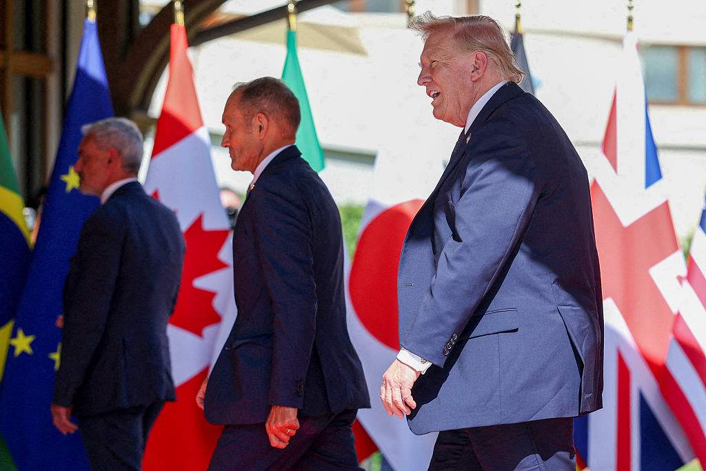 Trump arrives with Iran deal to meet wary world leaders at G7 summit