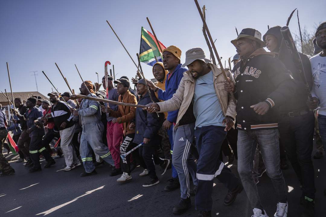 People gather to stage an anti-immigrant demonstration to call on the government to deport irregular immigrants in the Benoni area east of Johannesburg on 5 June 2026.
