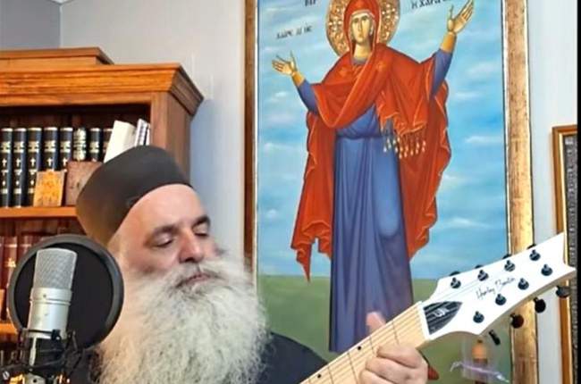 Father Dionysios Tabakis’ electric guitar skills have made him an unlikely internet sensation.