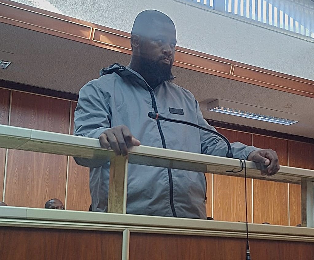 Man in court for murder after ex-finance head shot dead outside former workplace
